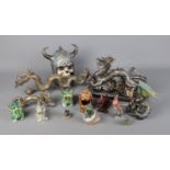 A collection of dragon figures including several oriental style examples. Also includes large