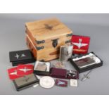 A hardwood box with Parachute Regiment insignia and quantity of related collectables. Includes hip