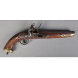 A late eighteenth century flintlock cavalry pistol. With walnut full stock and brass mounts.