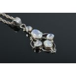 A white metal moonstone pendant on sterling silver chain.