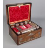 A Victorian rosewood vanity box and contents. Having mother of pearl inlay, fitted interior and side