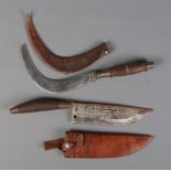 Two antique weapons/tools. A knife with wooden handle and leather sheath along with a similar