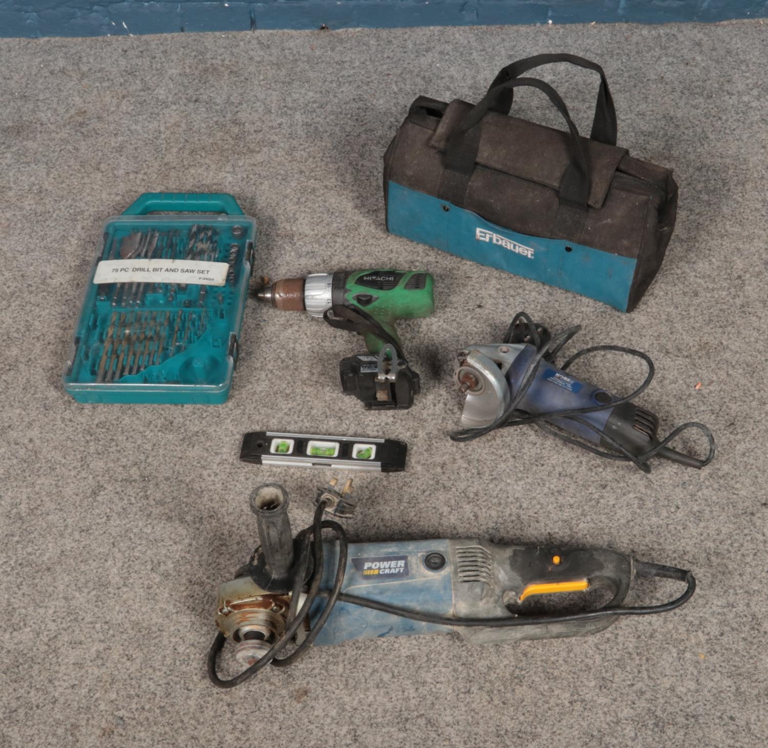 A quantity of assorted tools including Hitachi cordless drill, Kobe angle grinder, 75pc drill bit