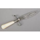 A small silver bookmark formed as a dagger with mother of pearl handle. Assayed Birmingham 1925. (