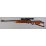 A BSA .22cal under lever air rifle with Nikko Stirling Tiara 4x28 scope. Cocks and fires. CAN NOT