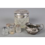 A quantity of silver and white metal. Including small silver jug, white metal topped glass jar,