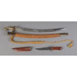 A 20th century Indian dress sword with scabbard along with similar knife example. CANNOT POST