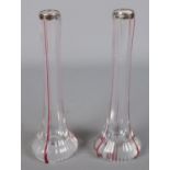 A pair of glass specimen vases with coloured streaks and silver rim. Assayed London 1904.