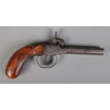 A 19th century percussion cap pistol with octagonal barrel. Length 19.5cm. CANNOT POST OVERSEAS