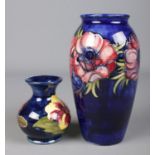 Two Moorcroft pottery vases. Includes larger vase decorated in the Anemone design 19cm, and a