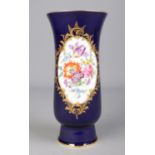 A 20th century Meissen vase with dark blue glaze, gilt borders and a hand painted panel depicting