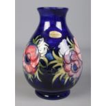 A Moorcroft pottery vase decorated in the Anemone design. 19cm.