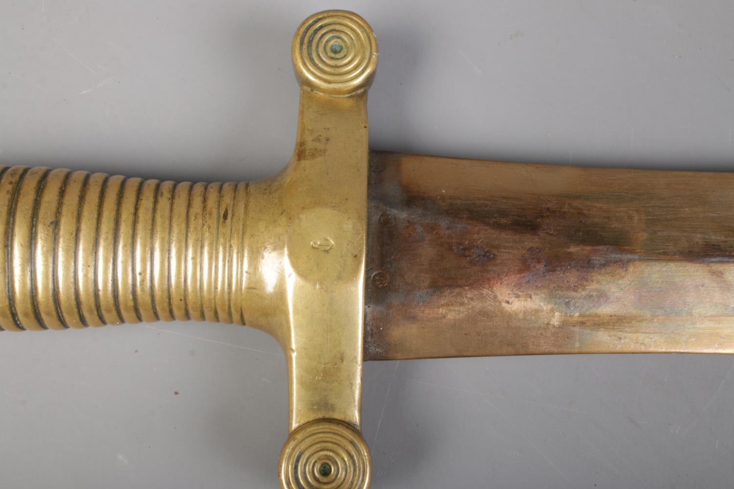 A French 1831 model short sword with brass and leather scabbard. Bearing anchor mark to cross guard, - Image 4 of 4