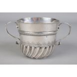 A William III silver porringer with twin S-scroll handles. Initialled IV and TG to base. Assayed