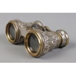 A pair of Victorian silver bodied opera glasses, with embossed decoration. Assayed for Birmingham,