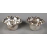 A pair of Victorian scalloped silver salts. Assayed Birmingham 1891 by A & J Zimmerman Ltd, 18g.