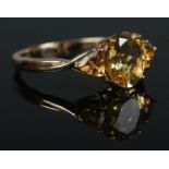 A 9ct Gold citrine trilogy ring. Size Q. Total weight: 2.5g