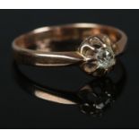 A 9ct Rose Gold old cut diamond solitaire ring. Assayed for Birmingham 1916. Size RÂ½. Total weight: