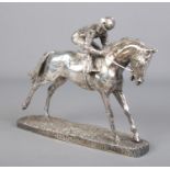 A silver filled model of a horse and jockey. Assayed Sheffield 1999 by Camelot Silverware Ltd.