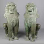 A large pair of bronze Khmer style sculptures modelled as temple lions. Height 60cm.