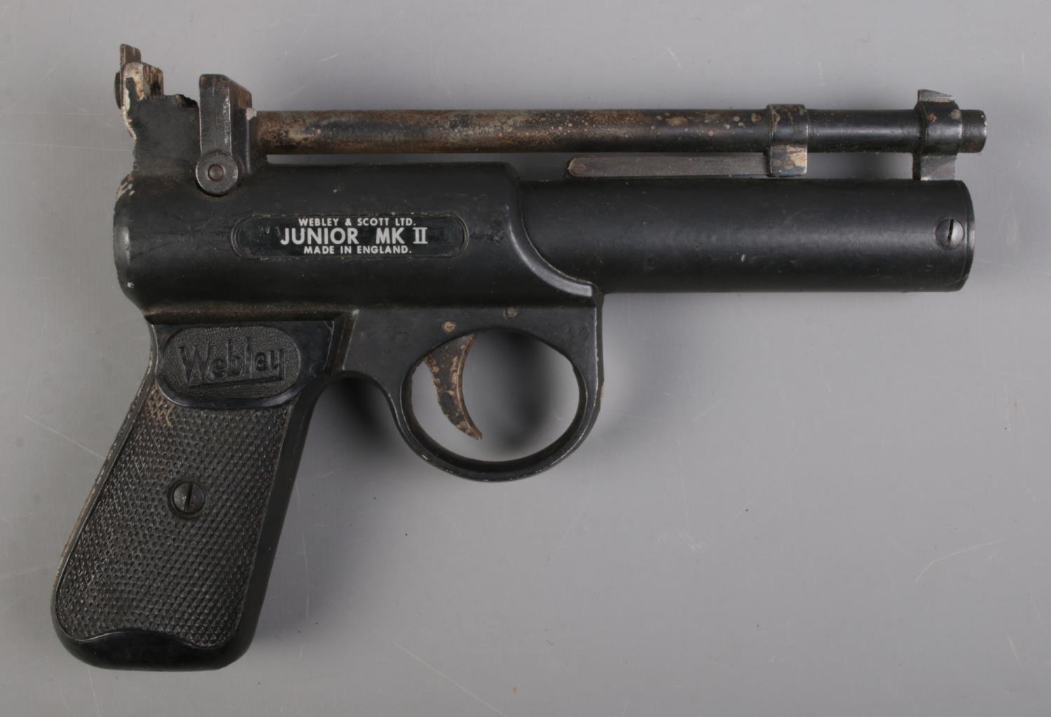 A Webley Junior MK II 0.177cal air pistol. CANNOT POST OVERSEAS Black coating flaking from body,