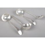 Two silver sugar shifting spoons along with two silver ladles. Various hallmarks and makers.