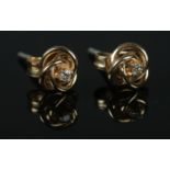 A pair of 9ct Gold diamond stud earrings Total weight: 0.9g.