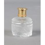 A silver gilt topped scent bottle.