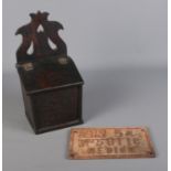 A hinged oak salt/offertory box, together with a cast iron engineer plate.