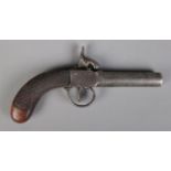 A 19th century percussion cap pistol with screw off cylindrical barrel. Bearing Birmingham proof
