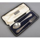 A cased silver spoon and fork. Assayed Sheffield 1918 by James Dixon & Sons Ltd. 60g