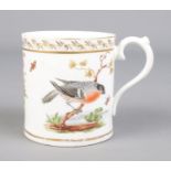 A late 18th/early 19th century cup with gilt borders and hand painted bird and floral decoration.