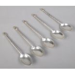 Five silver twisted stem teaspoons. Assayed Sheffield 1939 by Cooper Brothers & Son. 68g.