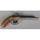 A 19th century double barrel percussion cap pistol. Length 21.5cm. CANNOT POST OVERSEAS Does not