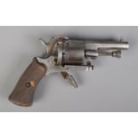 A late 19th century Belgian pin fire revolver. Marked ELG to cylinder and bearing crowned R proof