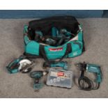 A large bag of Makita tools including cordless drills, drill bits, saw, battery packs, etc. Not