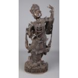 A large carved wooden figure formed as a Burmese/Thai dancer. Height 63cm. Some damage. In need of