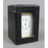 A French brass carriage clock with leather and glass travel case. Having Roman numeral markers and