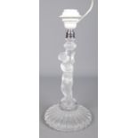 A Baccarat glass figural table lamp formed as a cherub. Bearing etched factory mark to base and