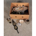 A box of assorted metal wares to include silver plate and brass examples.