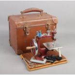 A vintage cased child's sewing machine.