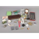 A quantity of collectables to include brass figures, Dunlop Golf Balls, Rolls Razor, etc.