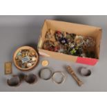 A box containing an assortment of items, including bass door knocker formed as a longcase clock,