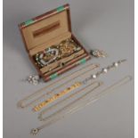 A novelty jewellery box with contents. Including rings, chains, bracelets, etc.