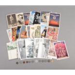 A collection of replica Third Reich postcards along with small quantity of Third Reich WWII coins.