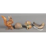 Four ceramic Kaiser animals. Including hedgehog, seal, squirrel and rat.