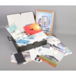 A box file with contents of Concorde ephemera. Includes covers, framed stamp sheet, flight