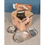 A box of metalwares. Includes Denmark stainless steel trays etc.