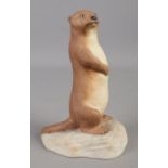 An Aynsley model of an Otter, stamped to base. 16cm high.