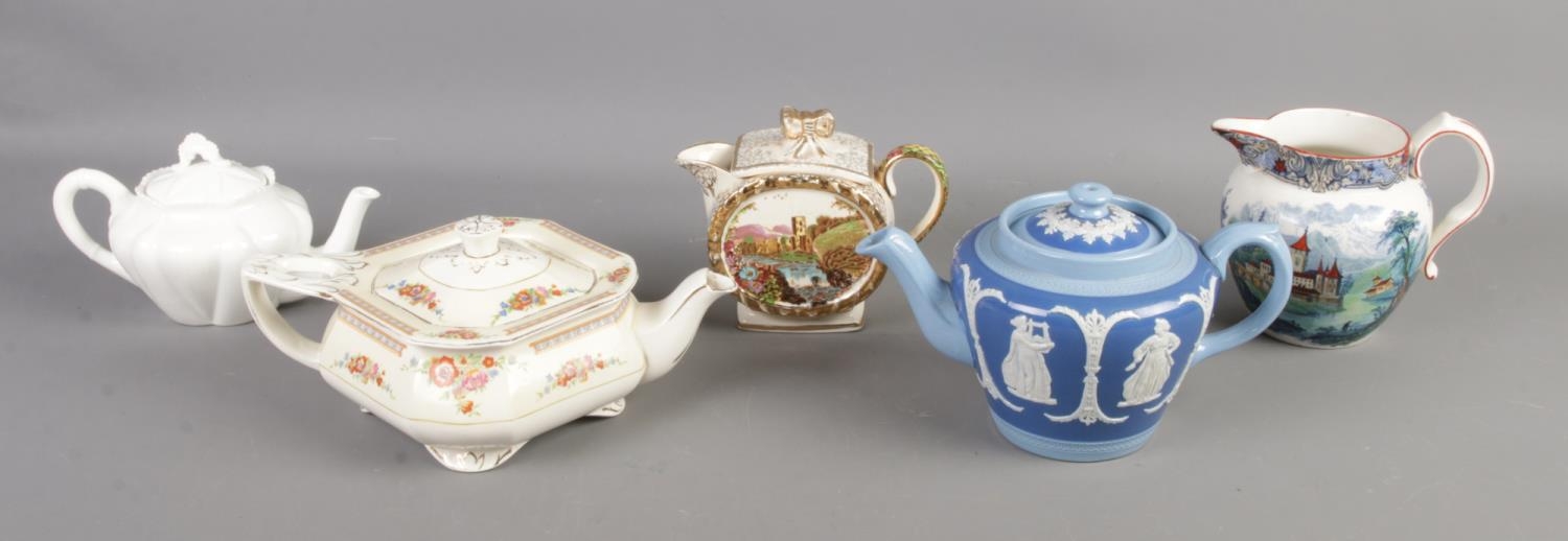 A collection of ceramic teapots and jugs, including Royal Doulton Geneva, Dudson Bros. and W.H